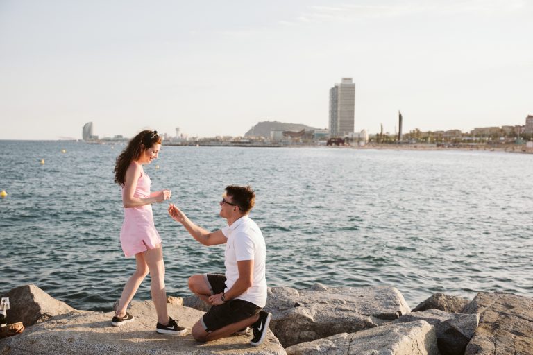 Romantic sunset proposal at the beach in Barcelona