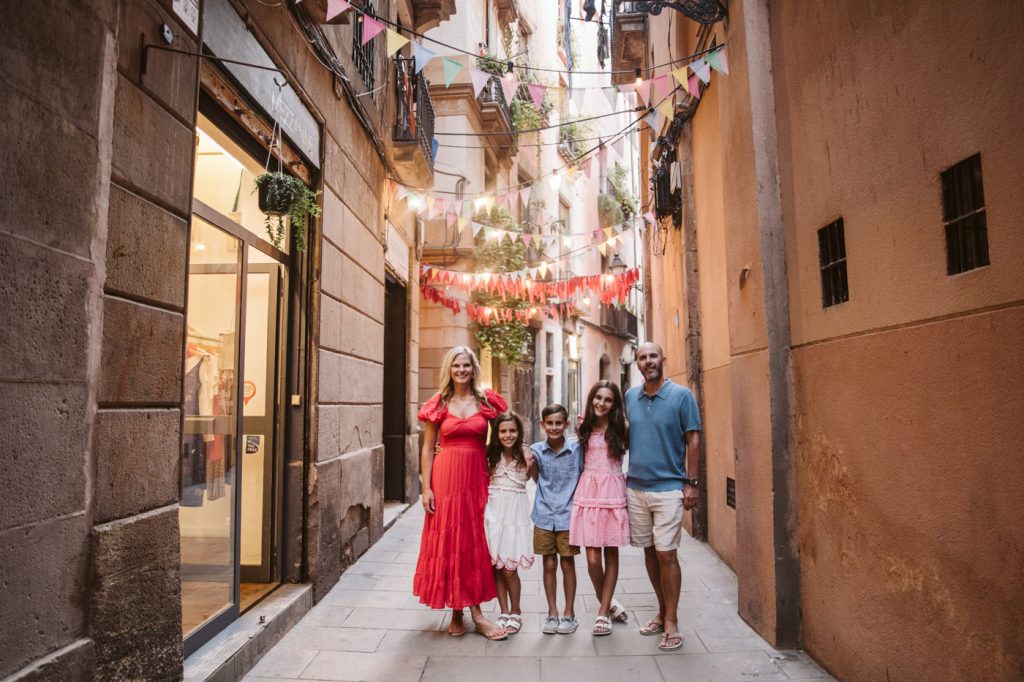 A family wearing bright colors in el Born neighborhood in Barcelona
